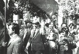 И через 20 лет, тем же строем — на тот же праздник!!! Шлют мне, уже наблюдателю, поклоны с цветами! В центре и Володя (теперь уже Ильич!) Бугаев, мой выпускник СШ-8, улыбаясь машет мне рукой!!! 

Затерялись в строю еше три моих ученика из той же школы, ныне преподаватели: С. Хорьков, И. Балабан и С. Борисенко. Так меняет местами жителей наша планета.